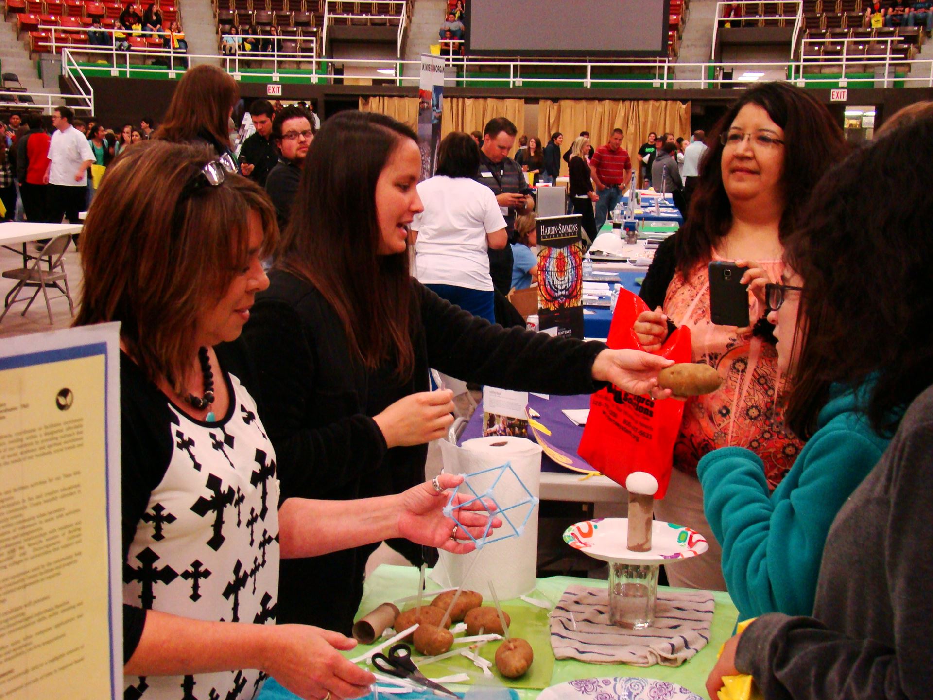 Students conduct experiment with potatoes.
